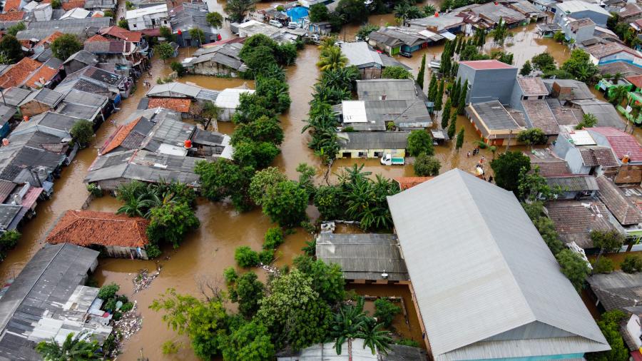 An aerial view of a town experiencing flooding
