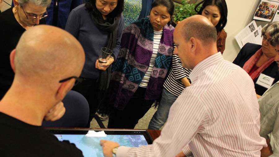 A group looking at something on a screen