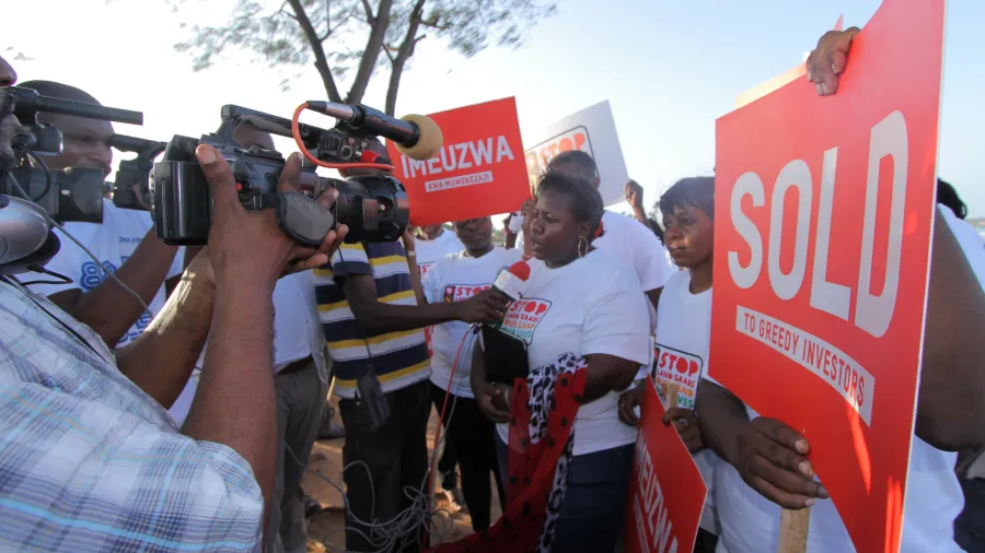 A group of people protesting land grabs being interviewed