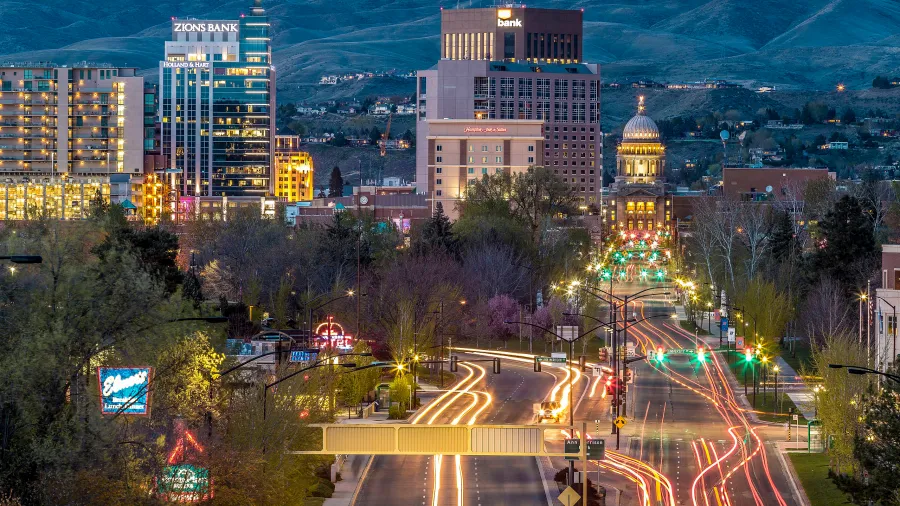 A nighttime view of Boise, Idaho, showing the movement of cars streams of flowing light