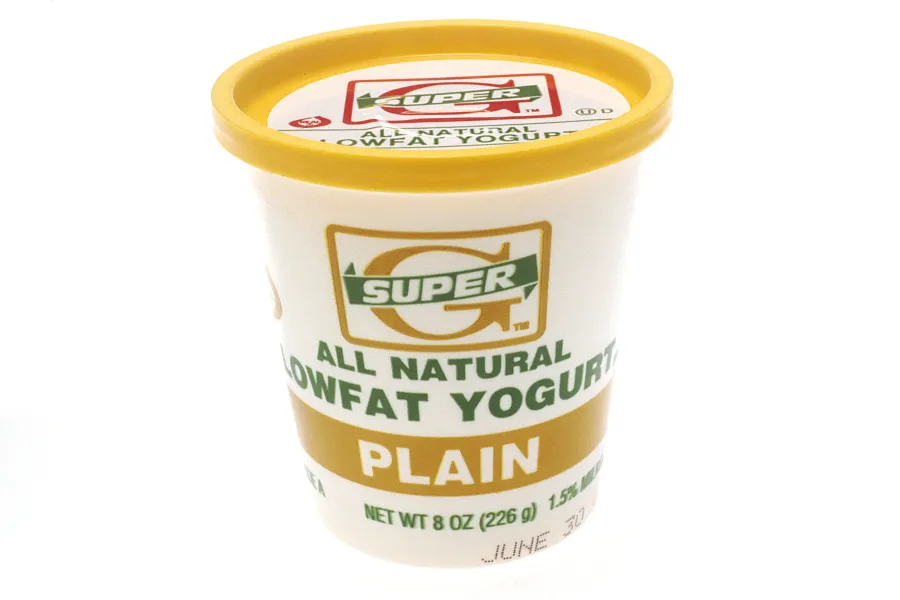 A yellow plastic yogurt container
