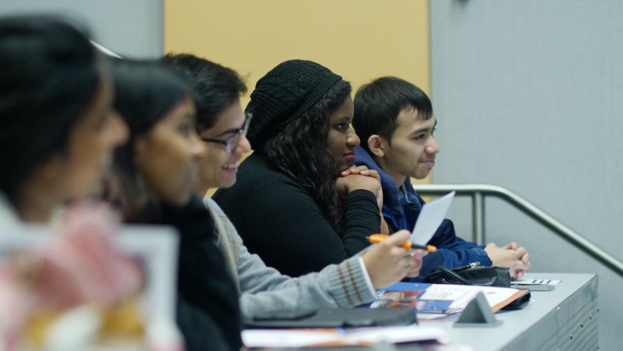 A group of students sitting in a row