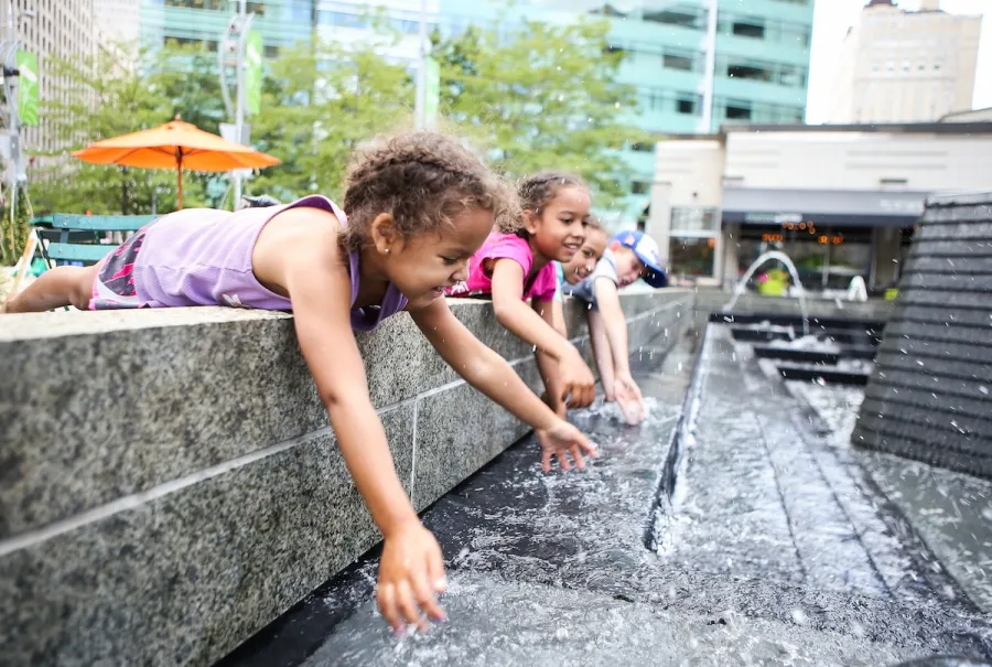 Children playing in a fountain