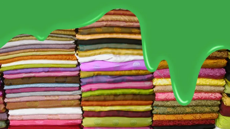 Stacks of clothing with green sludge dripping over them