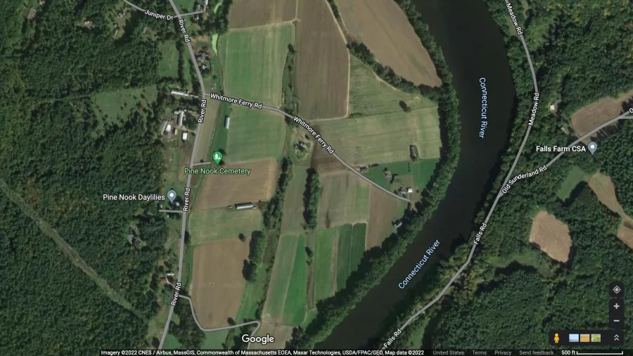 A satellite image of farmland next to a river