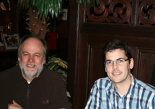 Researchers Volker Grimm and Neil Carter sitting side by side