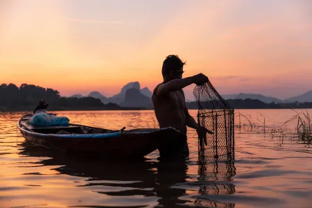 Man fishing with cage