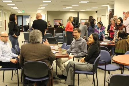 People huddled together in groups at SESYNC