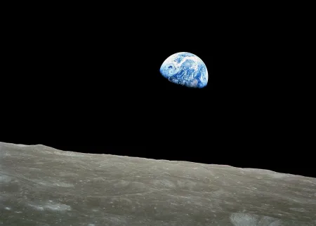 A photo of the Earth rising in space taken from the surface of the moon
