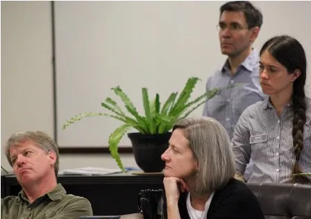 Four researchers listening to a discussion