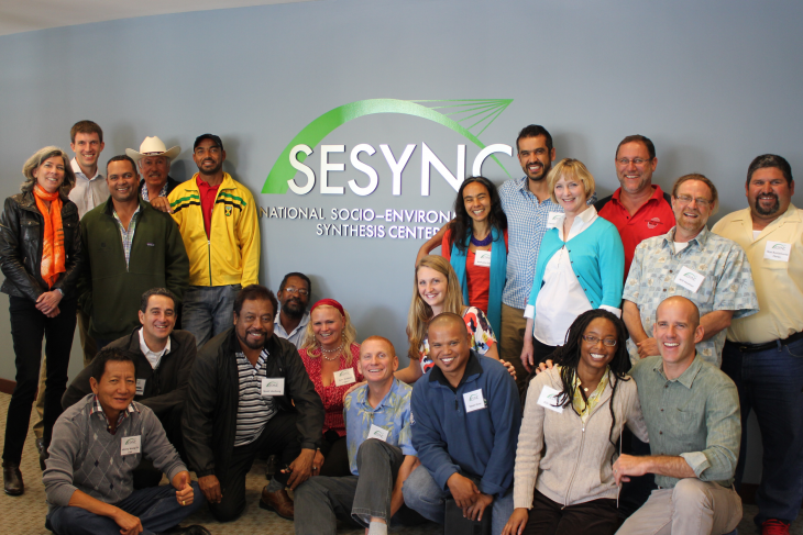 The Learning Exchanges team gathered together in front of the SESYNC sign.