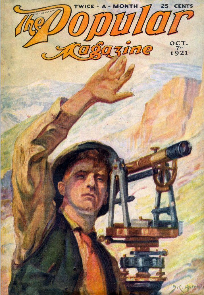 The cover of The Popular Magazine from October 1921 featuring an illustration of a young white man looking through a piece of surveying equipment with his hand raised above his head and mountains in the background