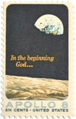 A postage stamp with the Earthrise pictured and a text overlay that says, "In the beginning God..."